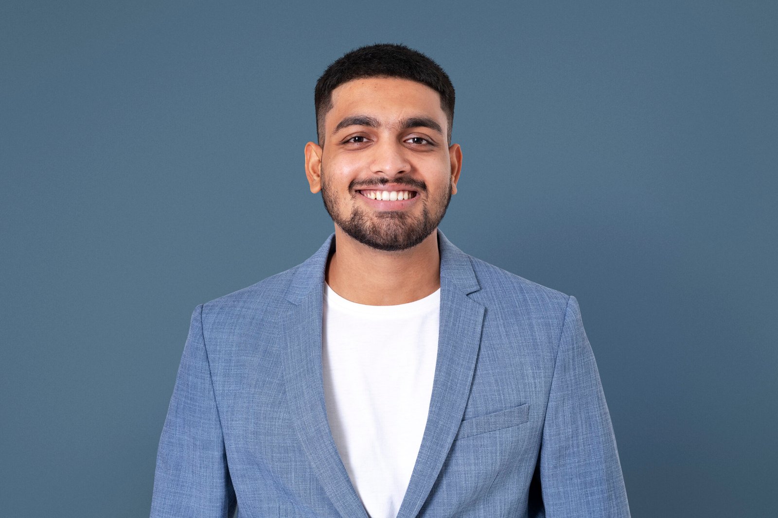 Cheerful Indian businessman smiling closeup portrait for jobs and career campaign